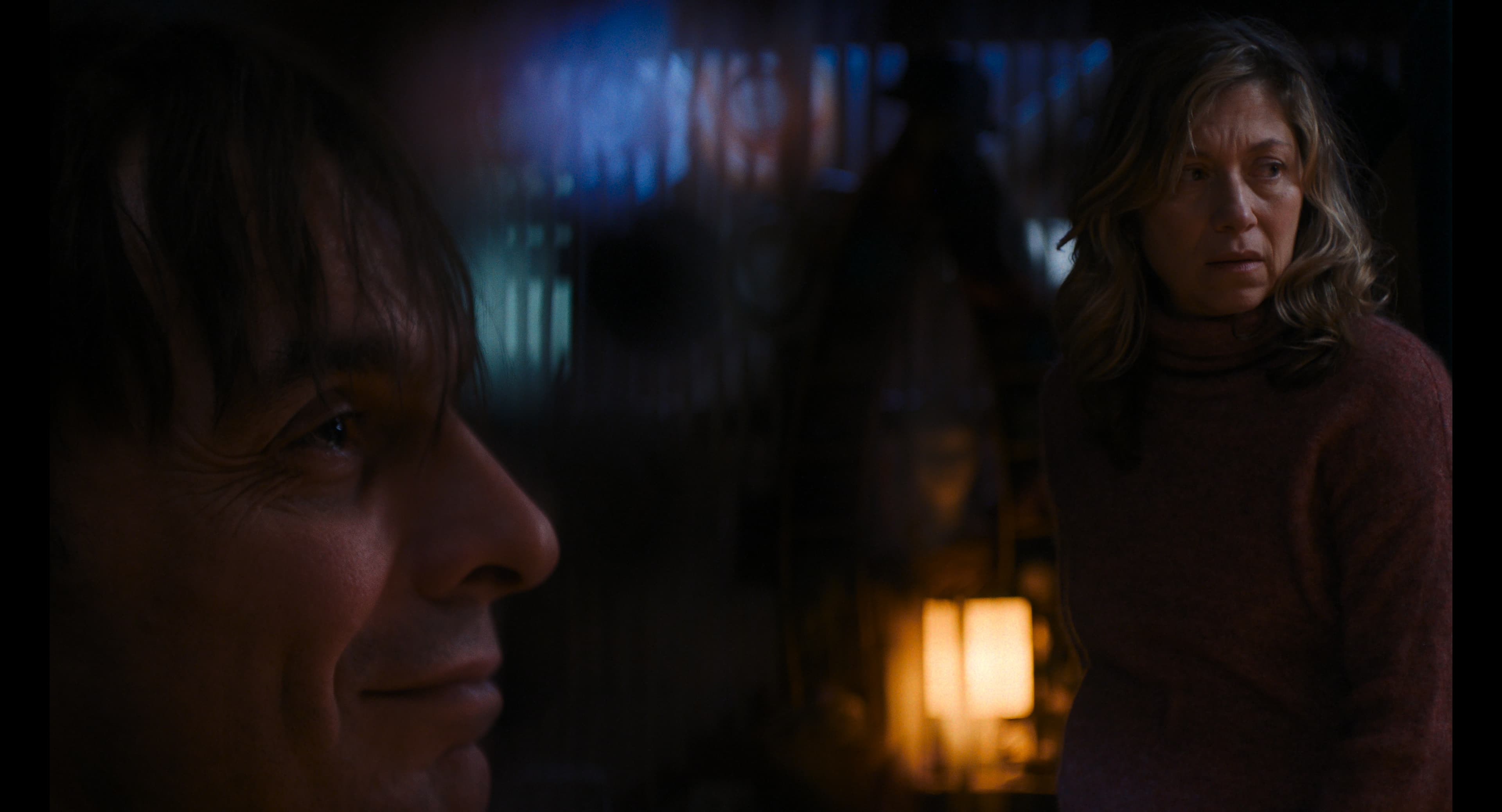 Solitary figure in an urban exterior composition.